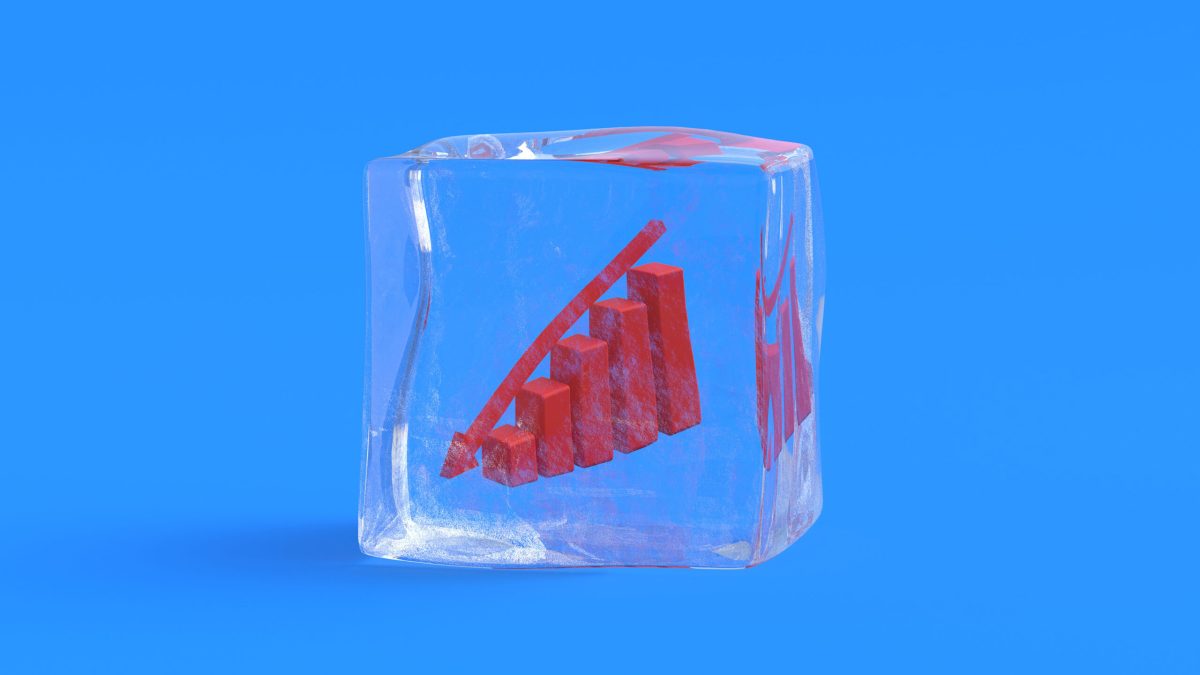 Columns graph with red down arrow in ice cube. 3d render