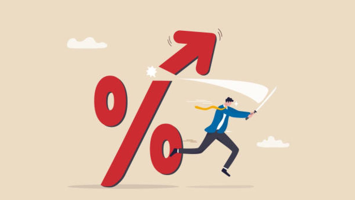 Cut or reduce inflation by monetary policy, FED, federal reserve or central bank increase interest rate to control inflation to acceptable level concept, businessman cut percentage sign with sword.