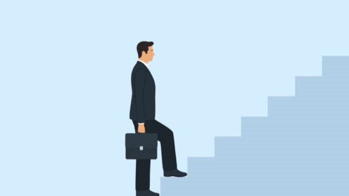 Side View Of Businessman Walking Up Stairs. Career Growth And Development Concept